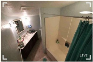 Hidden bathroom camera recording from a ceiling